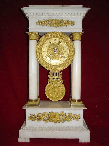 Appraisal: Neoclassical style gilt metal mounted white marble temple clock th