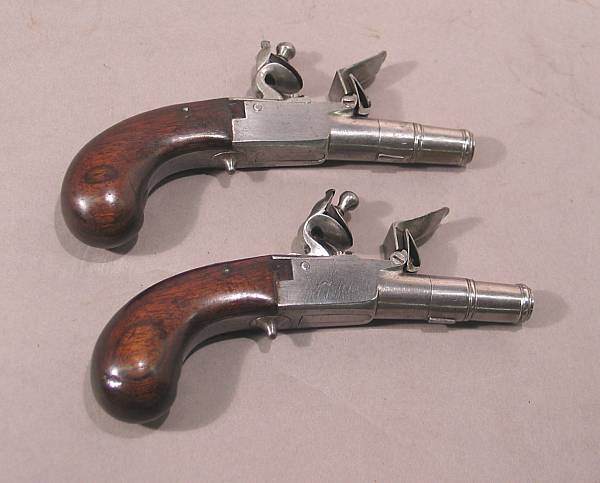 Appraisal: A pair of continental flintlock pocket pistols Having inch caliber