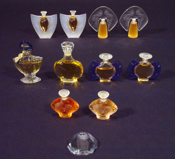 Appraisal: Nine Lalique glass scent bottles with moulded decoration together with