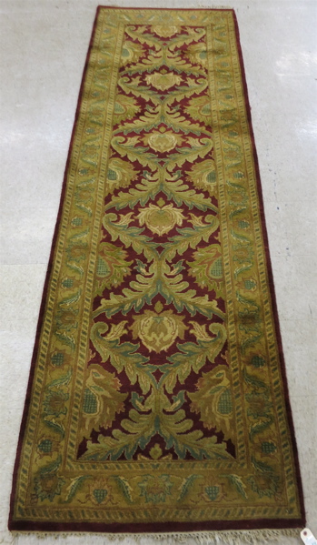 Appraisal: HAND KNOTTED ORIENTAL HALL RUG Indo-Persian overall foliate design on