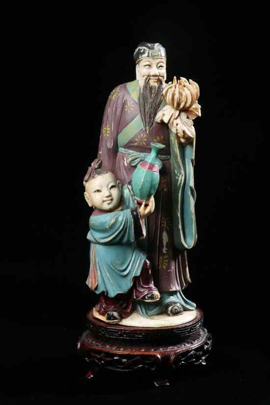 Appraisal: CHINESE POLYCHROME IVORY FIGURAL GROUP OF IMMORTAL AND YOUTH Painted