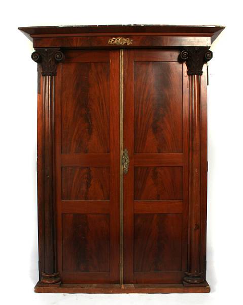 Appraisal: A late Empire mahogany armoire legs extant height ft in