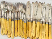 Appraisal: Ten silver plated fish knives and eleven forks with carved