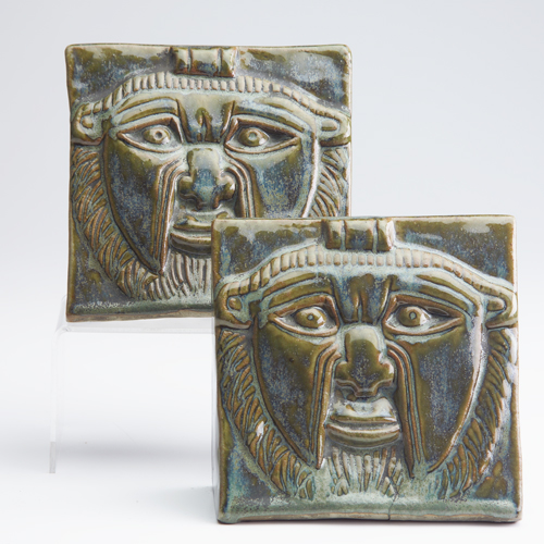 Appraisal: FULPER Pair of Aztec mask bookends covered in green and