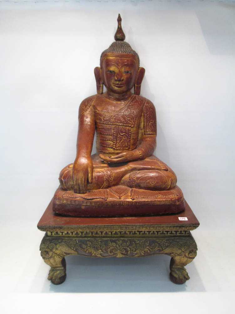 Appraisal: SOUTHEAST ASIAN CARVED WOOD BUDDHA with rectangular base the figure