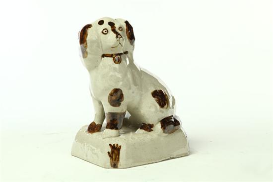 Appraisal: OHIO POTTERY DOG Akron Ohio late th century white clay