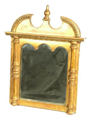 Appraisal: A small giltwood and gesso wall mirror with a shaped