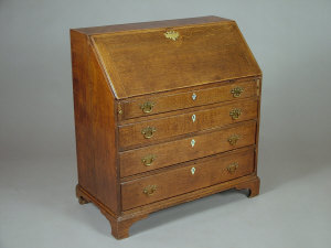 Appraisal: A George III oak slope front writing bureau with fitted