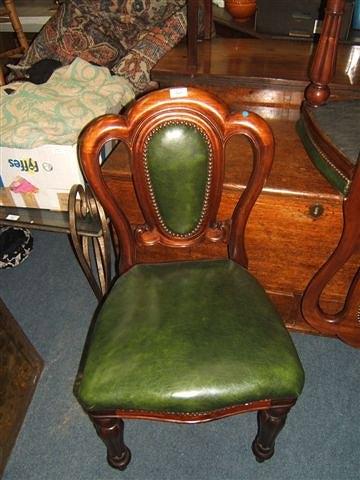 Appraisal: A set of twelve William IV style mahogany green leather