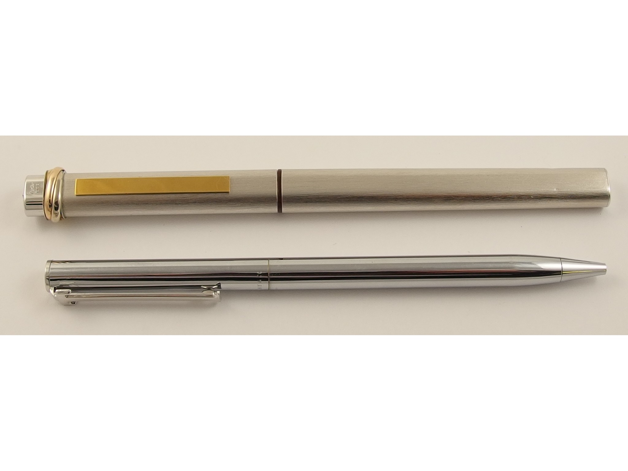 Appraisal: A Cartier pen in white brushed metalwith tricolour gold rings