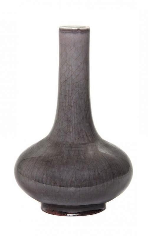 Appraisal: An Aubergine Flambe Glaze Bottle Vase Height inches An Aubergine