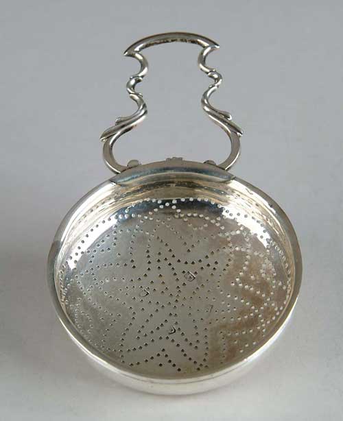 Appraisal: EARLY ENGLISH HANDLED TEA STRAINER Dish shaped strainer with scroll