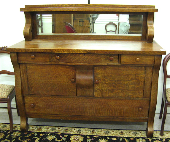 Appraisal: AN OAK EMPIRE REVIVAL SIDEBOARD American c having a mirror