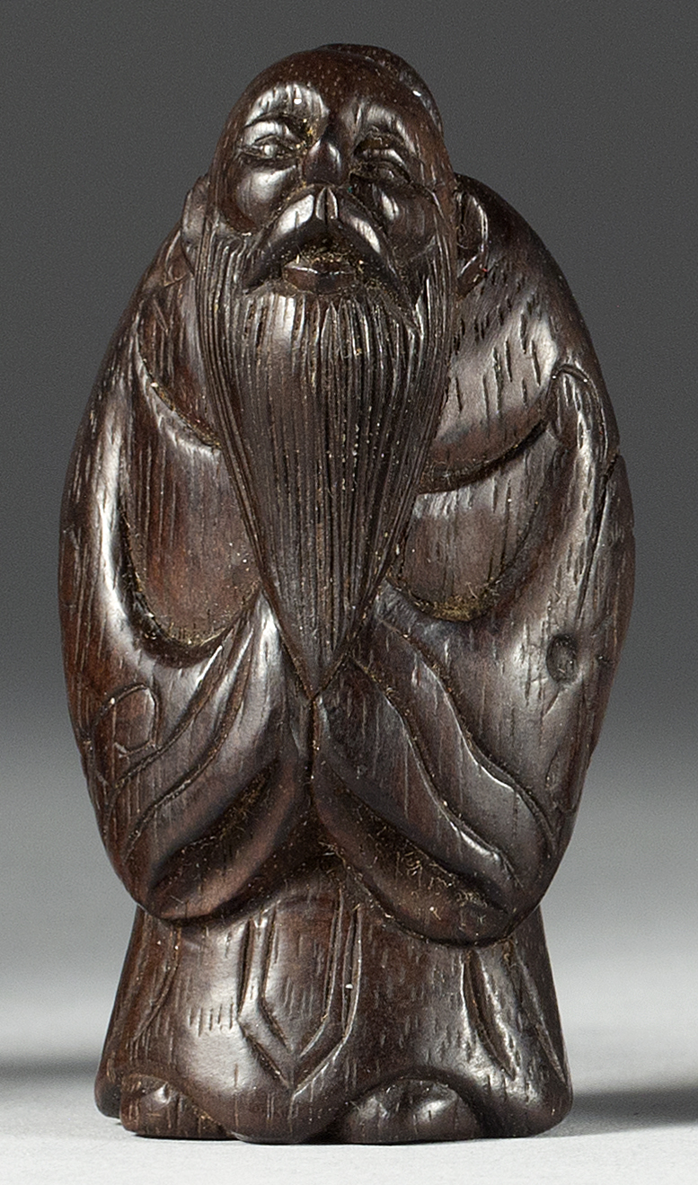 Appraisal: WOOD NETSUKE th CenturyIn the form of a standing sennin