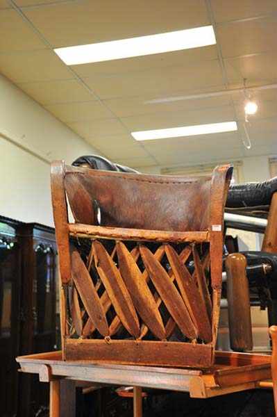 Appraisal: A BUSHMAN'S LEATHER BOUND CHAIR ON TIMBER BASE