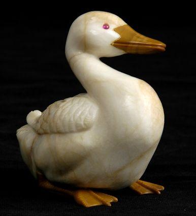 Appraisal: CARVED HARDSTONE FIGURE OF A DUCK The veined cream body