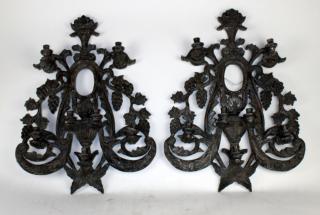 Appraisal: Pair of pierce carved wood wall sconces A pair of