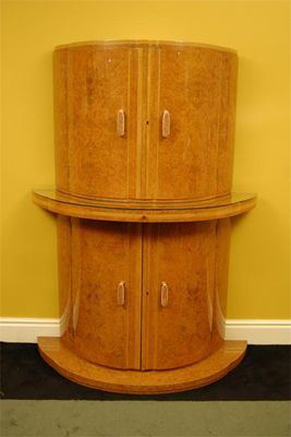 Appraisal: An Art Deco burr maple cocktail cabinet possibly by Hille