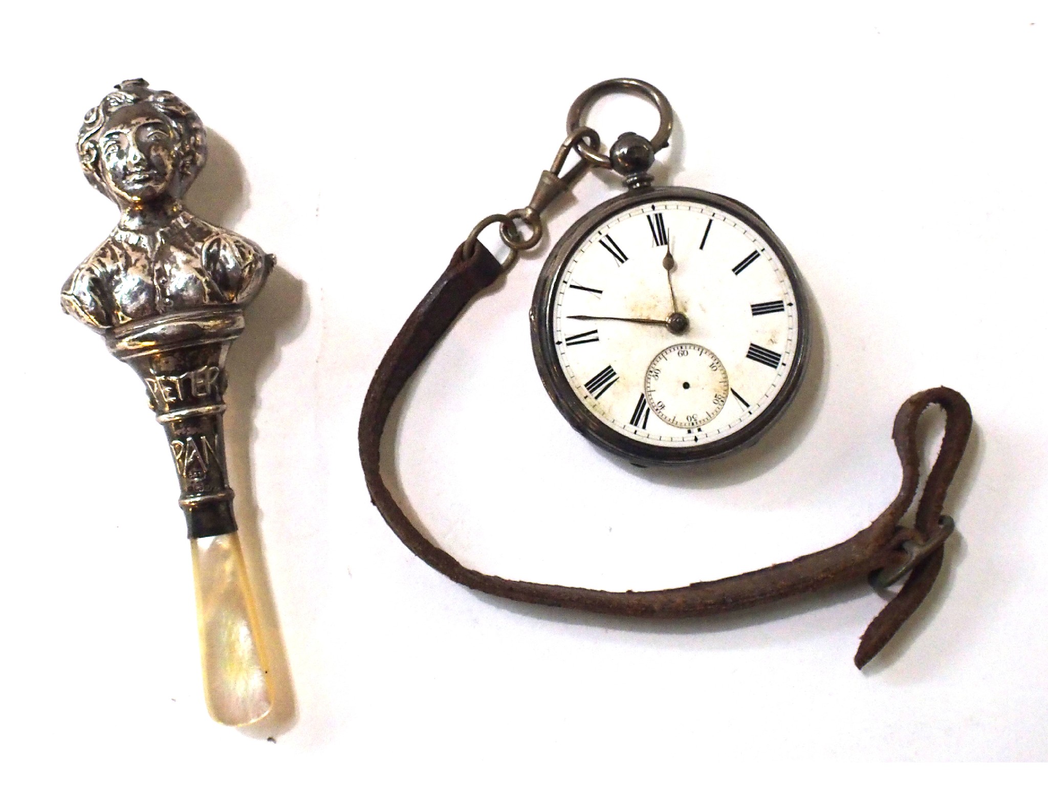 Appraisal: A lot comprising a part baby rattle and a silver