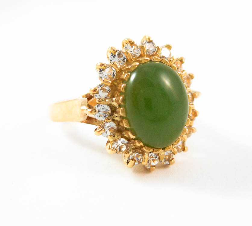 Appraisal: GREEN HARDSTONE AND EIGHTEEN KARAT GOLD RING with round-cut cubic