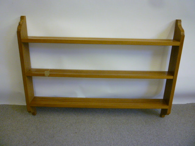 Appraisal: AN OAK OPEN DELFT RACK by Robert Mouseman Thompson comprising