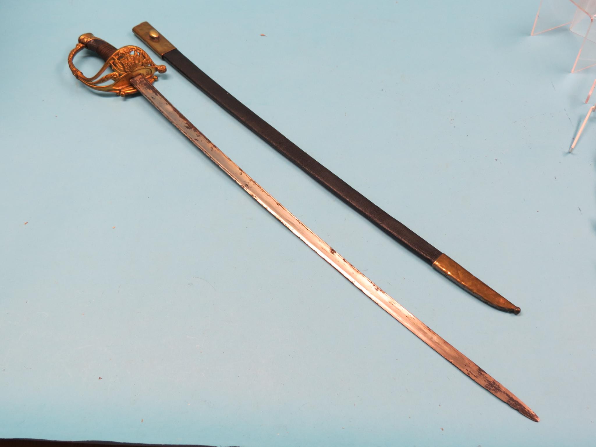 Appraisal: A dress sword brass hilt stamped A Feu wire grip