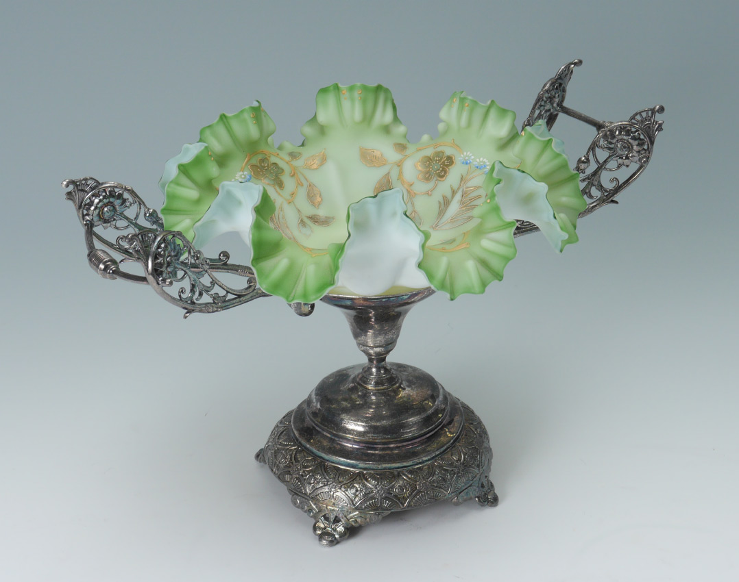 Appraisal: VICTORIAN ART GLASS BRIDES BASKET Double handle silverplate stand green