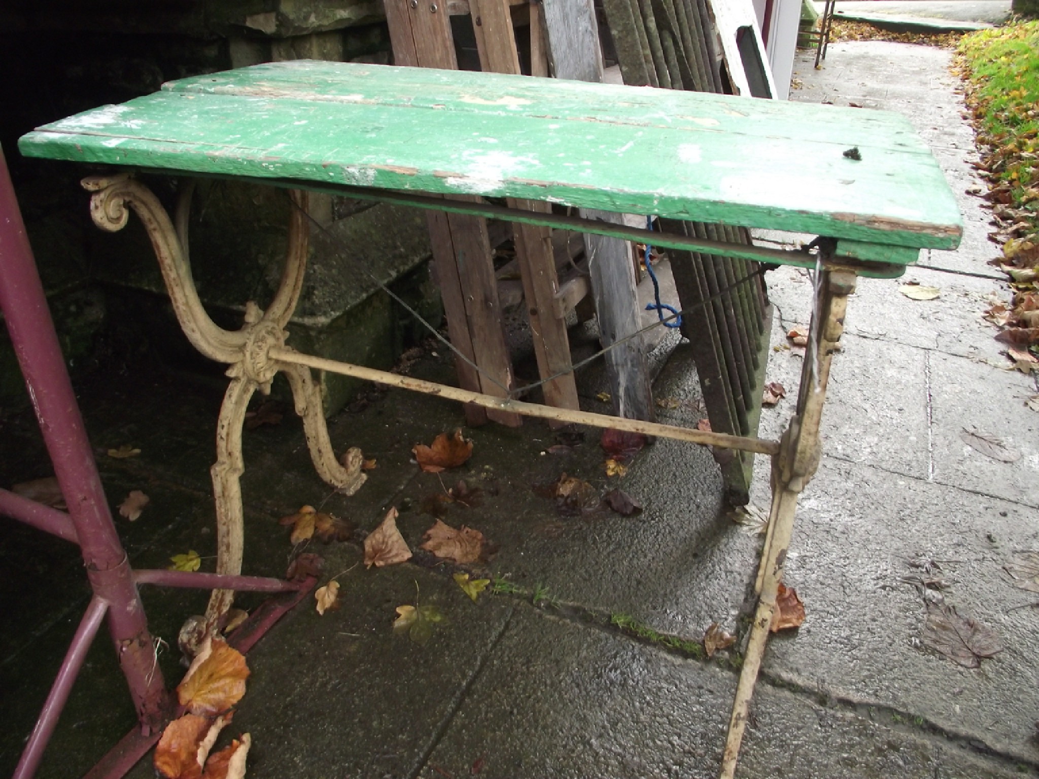 Appraisal: A th century cast iron garden pub table the distressed