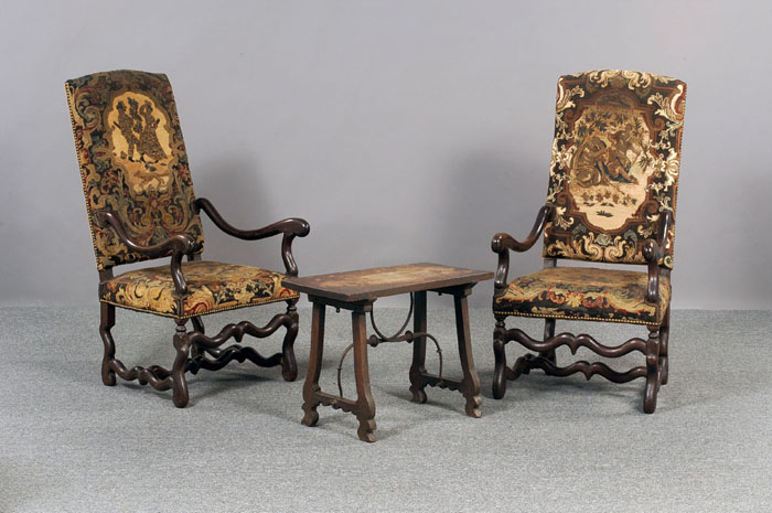 Appraisal: PAIR OF LOUIS XIV STYLE WALNUT FAUTEUILS EACH RAISED ON