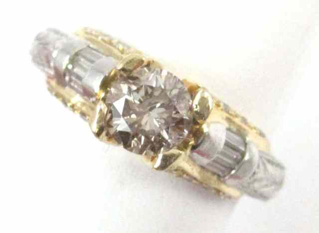 Appraisal: DIAMOND PLATINUM AND EIGHTEEN KARAT GOLD RING featuring a round