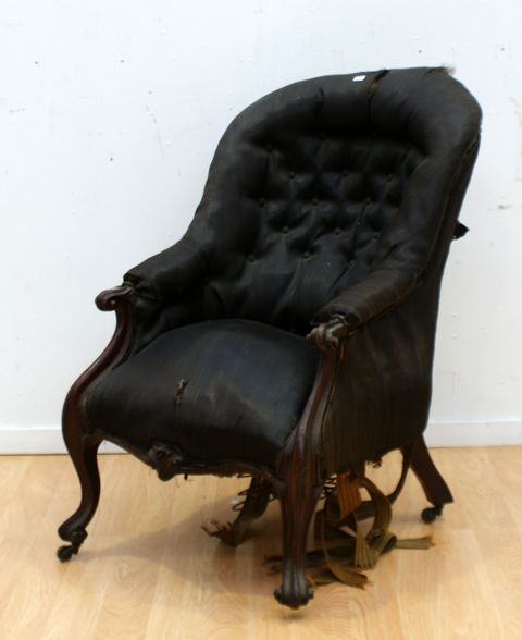 Appraisal: A Victorian walnut and upholstered armchair