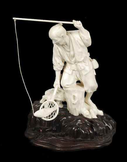 Appraisal: A Japanese ivory okimono carving of a fisherman holding a