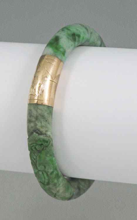 Appraisal: CARVED JADEITE JADE K GOLD BANGLE BRACELET K yellow gold