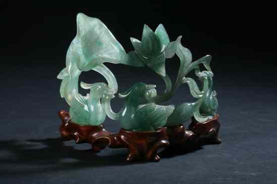 Appraisal: CHINESE GREEN JADE CARVING OF BIRD AND LOTUS - in