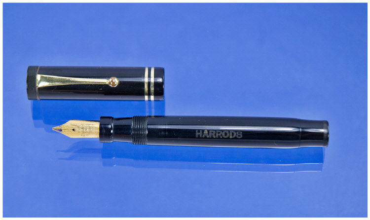 Appraisal: Harrods Pen s based on a Parker Junior button filler