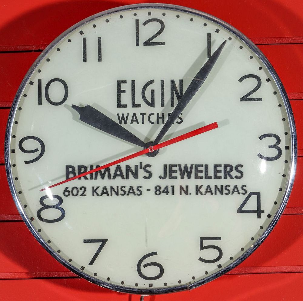 Appraisal: A LIGHTED ELECTRIC CLOCK ADVERTISING ELGIN WATCHES Th back lit