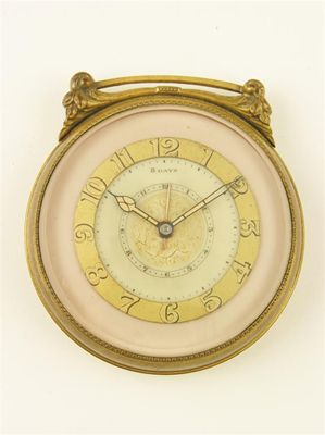 Appraisal: A gilt bronze cased travelling alarm clock the day movement