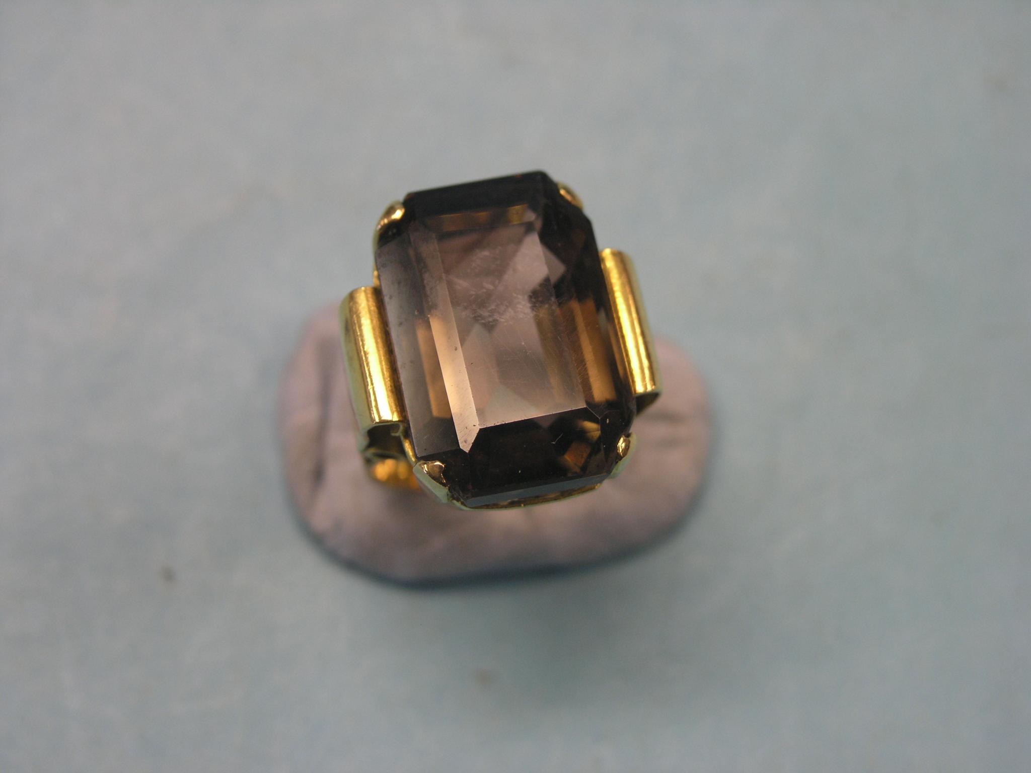 Appraisal: A large Chinese yellow metal dress ring step-cut topaz size