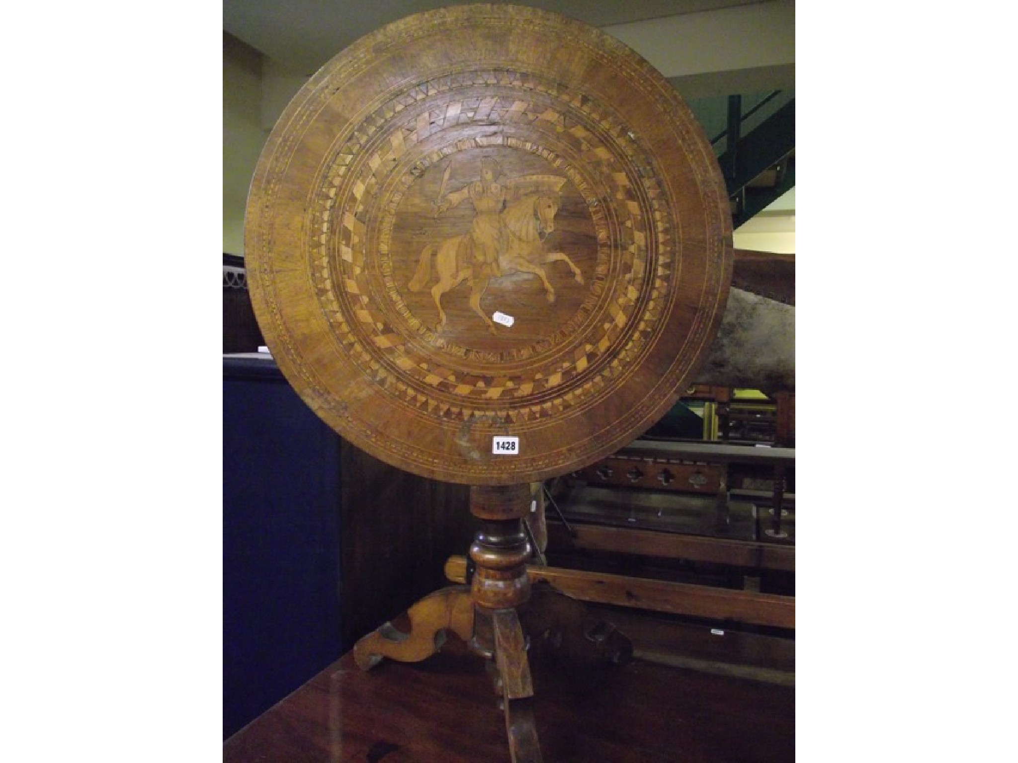 Appraisal: A Continental marquetry occasional table the circular top with geometric