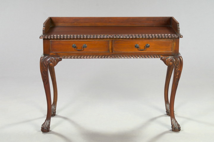 Appraisal: George III-Style Mahogany Writing Desk the galleried top with a