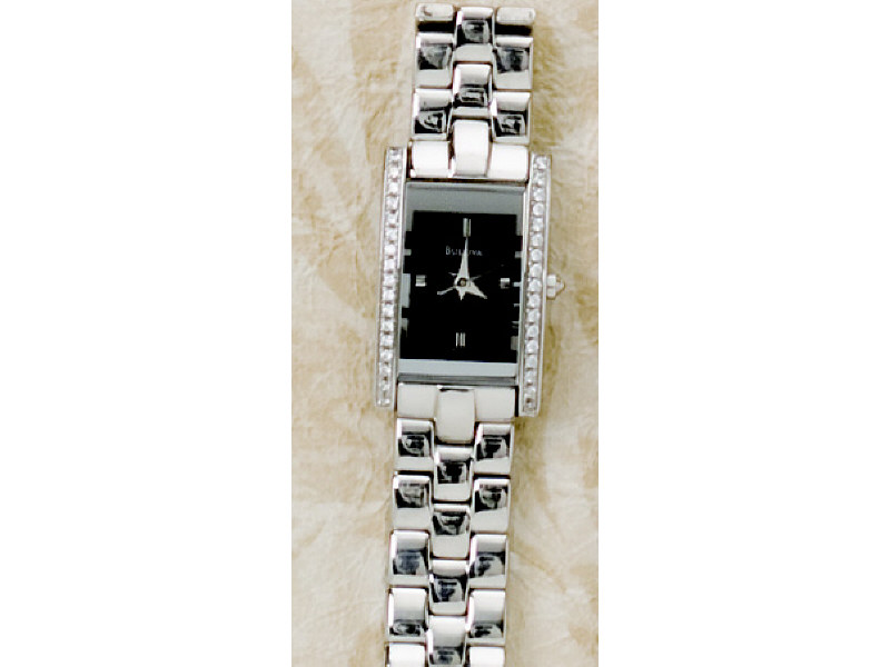 Appraisal: BULOVA WATCH Lady's stainless steel watch with black rectangular case