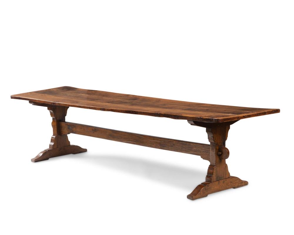 Appraisal: A Continental oak trestle table th Century With three-plank top