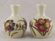 Appraisal: A pair of Moorcroft vases the pattern freesia on a