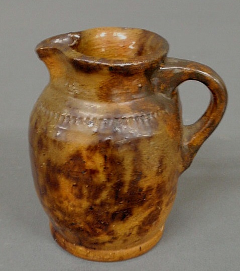 Appraisal: Diminutive Jacob Medinger redware pitcher with mottled glaze h