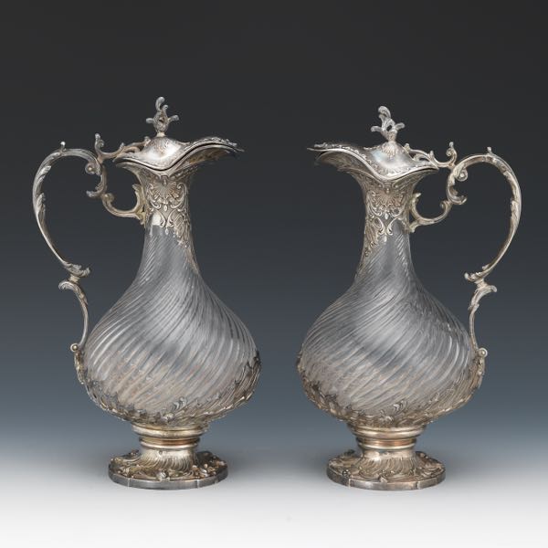 Appraisal: PAIR OF FLAMANT FILS GLASS AND SILVER CLARET JUGS Two