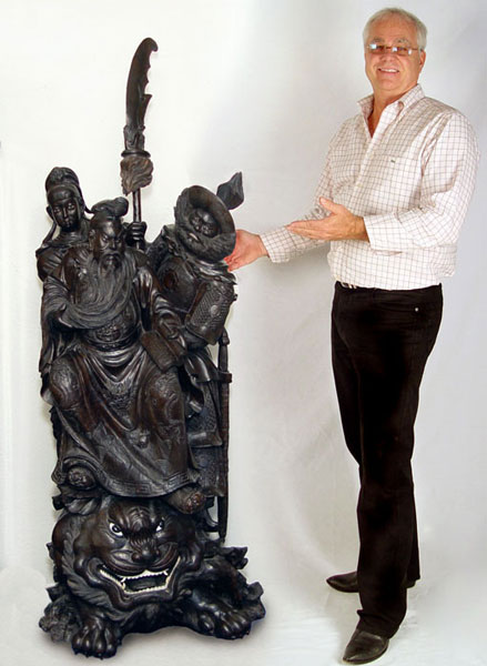 Appraisal: th C JAPANESE ROSEWOOD PALACE STATUE Depicts three figures on