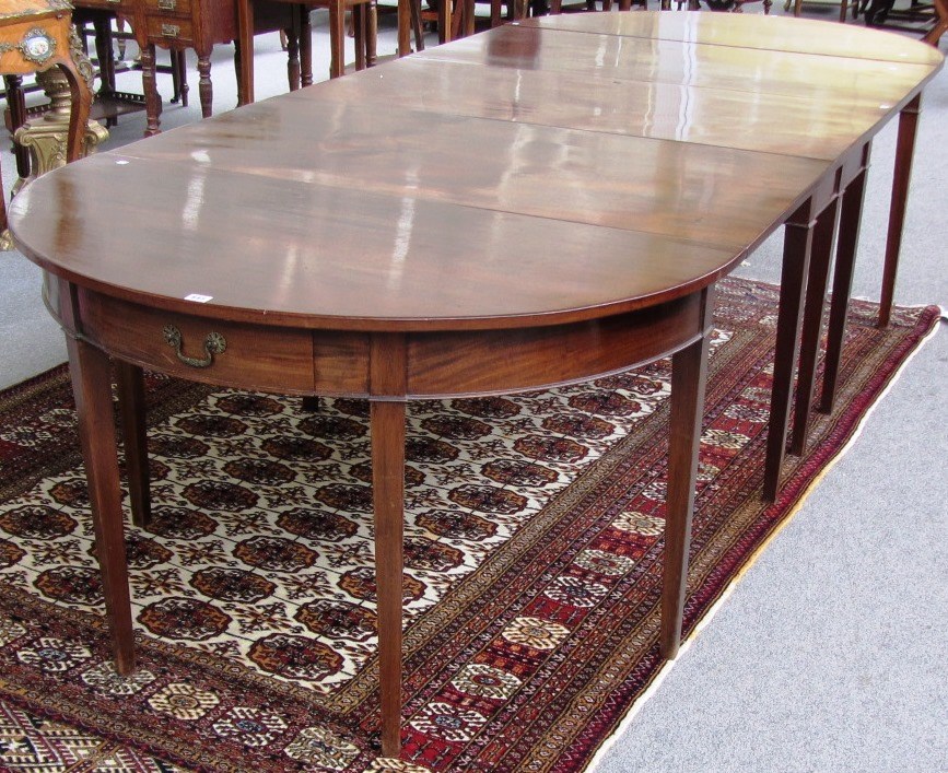 Appraisal: A George III mahogany three section 'D' end extending dining