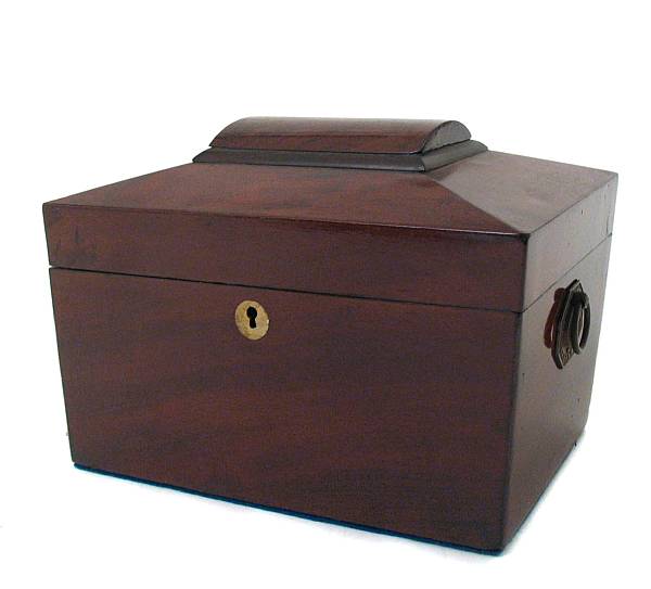 Appraisal: A Victorian mahogany sarcophagus form tea caddy height in width