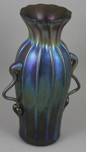 Appraisal: Blue iridescent vase h x w signed and numbered Good