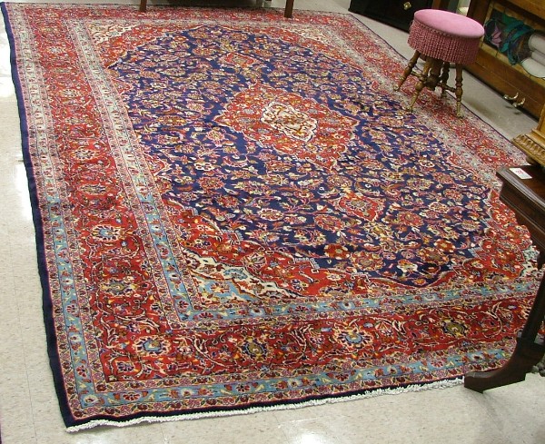 Appraisal: PERSIAN ARDAKAN CARPET floral and central floral medallion design on